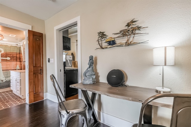 1414 Mechanic St, Galveston, TX 77550 - office with dark wood-style flooring and baseboards