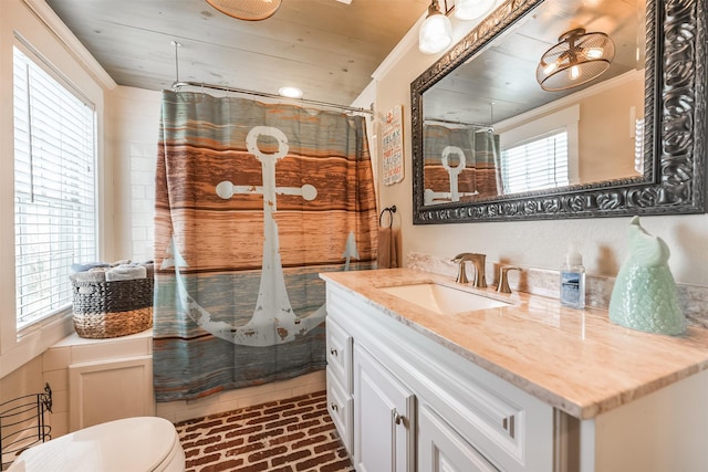 1414 Mechanic St, Galveston, TX 77550 - full bath featuring brick floors, ornamental molding, vanity, toilet, and a shower with shower curtain