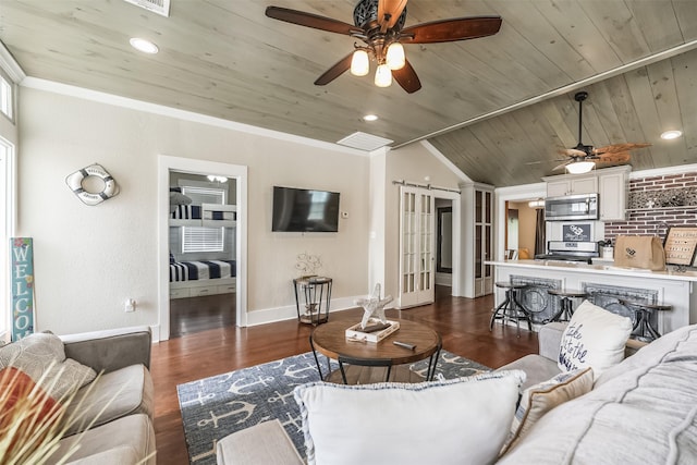 1414 Mechanic St, Galveston, TX 77550 - living area featuring a ceiling fan, wood ceiling, dark wood finished floors, a barn door, and baseboards