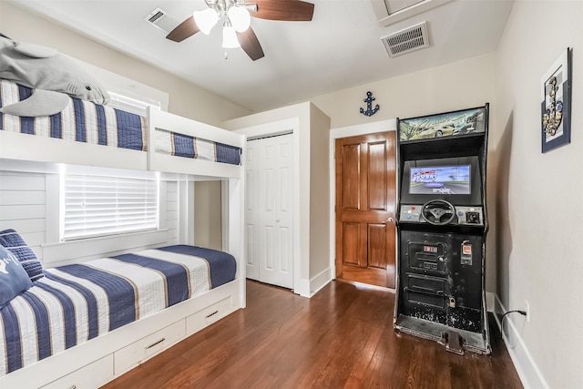 1414 Mechanic St, Galveston, TX 77550 - bedroom featuring wood finished floors, baseboards, a closet, and ceiling fan