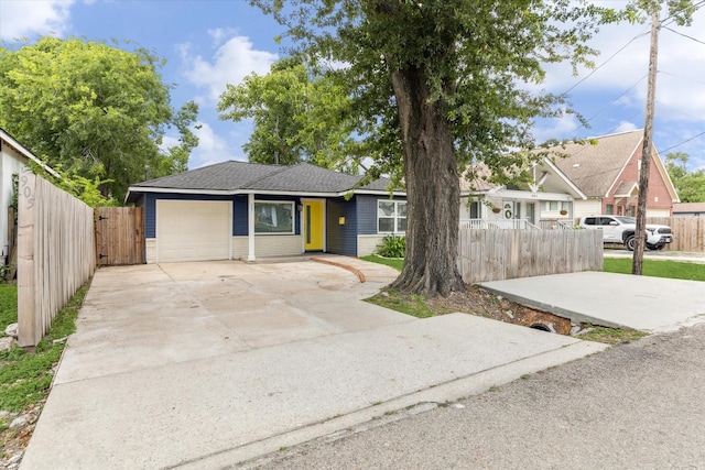 905 E 39th St, Houston, TX 77022 - view of front of house with an attached garage and concrete driveway