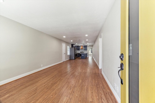 905 E 39th St, Houston, TX 77022 - entrance foyer featuring light wood-style flooring, baseboards, and recessed lighting