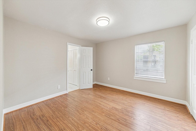 905 E 39th St, Houston, TX 77022 - unfurnished room with baseboards and light wood-style flooring
