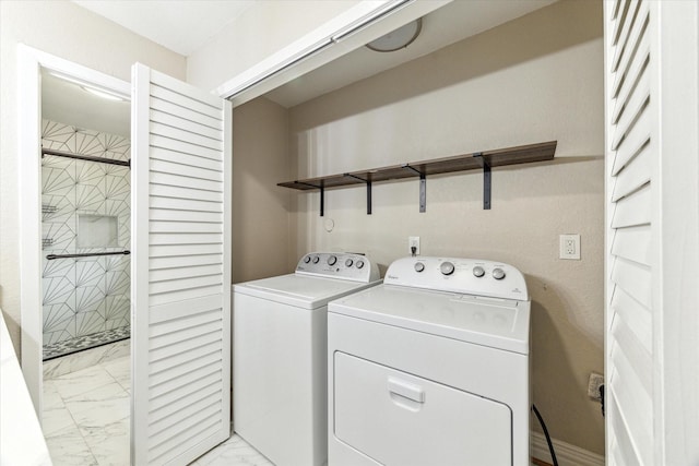 905 E 39th St, Houston, TX 77022 - laundry room featuring light marble finish floors and washer and clothes dryer