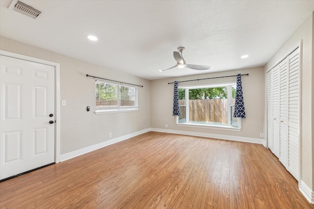 905 E 39th St, Houston, TX 77022 - foyer entrance featuring baseboards, light wood-style floors, a ceiling fan, and recessed lighting