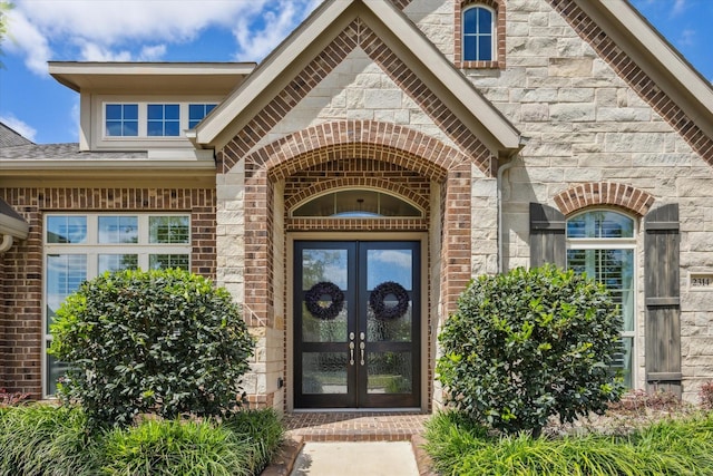 2314 Umber Oaks Ln, Brookshire, TX 77423 - entrance to property with french doors, brick siding, and stone siding
