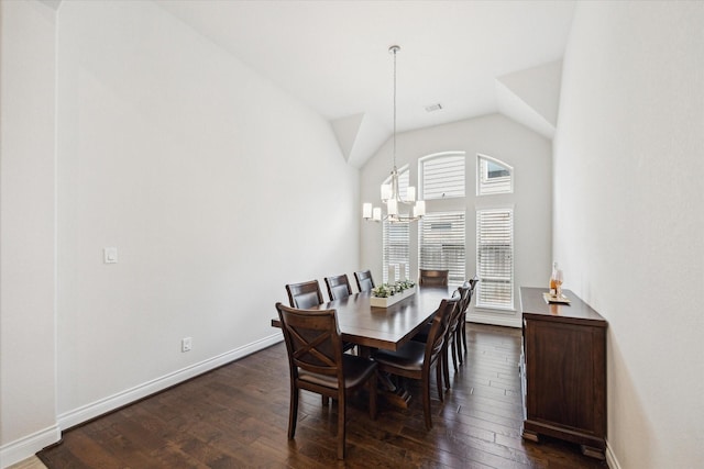 2314 Umber Oaks Ln, Brookshire, TX 77423 - dining room with a chandelier, dark wood-style flooring, baseboards, and vaulted ceiling