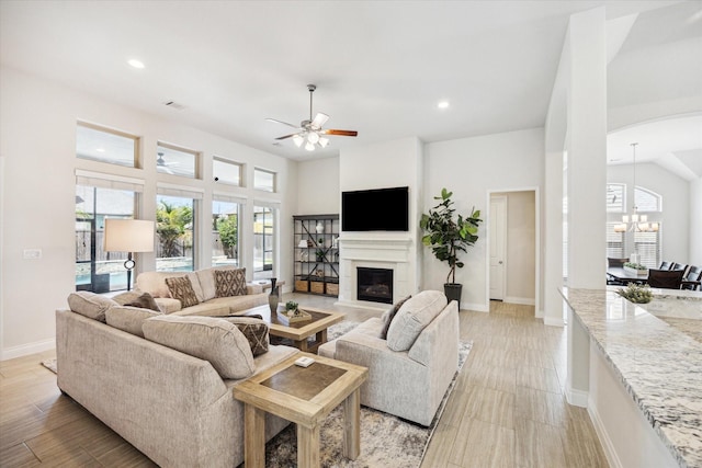 2314 Umber Oaks Ln, Brookshire, TX 77423 - living room featuring a chandelier, plenty of natural light, baseboards, and recessed lighting