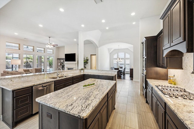 2314 Umber Oaks Ln, Brookshire, TX 77423 - kitchen featuring stainless steel appliances, a large island, open floor plan, a sink, and recessed lighting