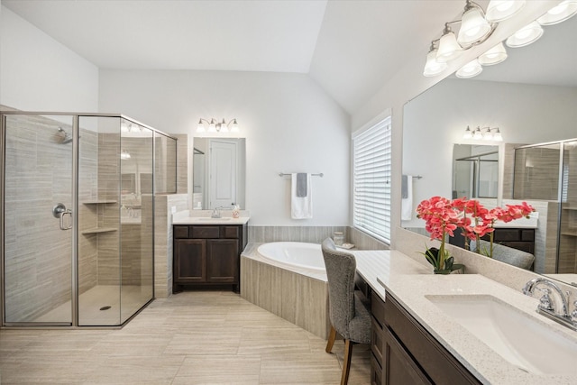 2314 Umber Oaks Ln, Brookshire, TX 77423 - full bathroom featuring two vanities, a shower stall, a bath, lofted ceiling, and tile patterned flooring