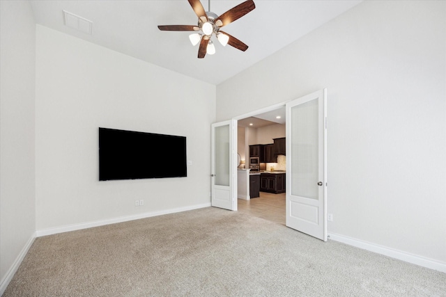 2314 Umber Oaks Ln, Brookshire, TX 77423 - unfurnished living room featuring light carpet, ceiling fan, baseboards, and recessed lighting