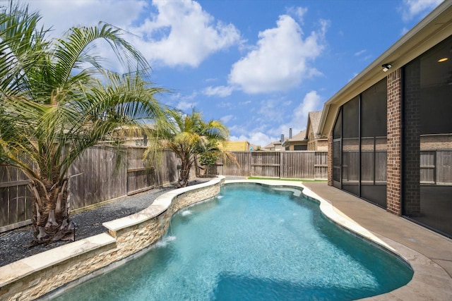 2314 Umber Oaks Ln, Brookshire, TX 77423 - view of swimming pool featuring a fenced backyard and a sunroom