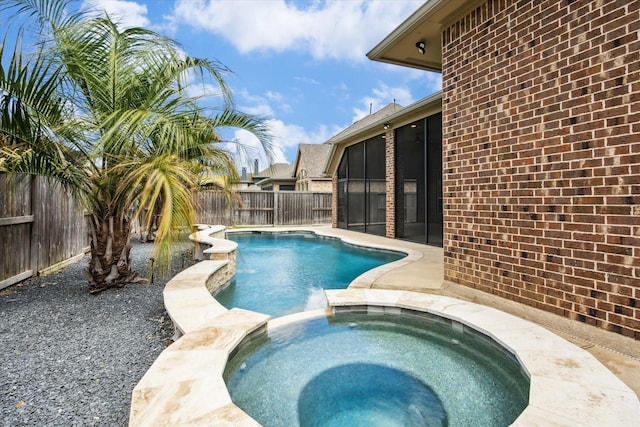2314 Umber Oaks Ln, Brookshire, TX 77423 - view of pool featuring a sunroom, a fenced backyard, and a pool with connected hot tub