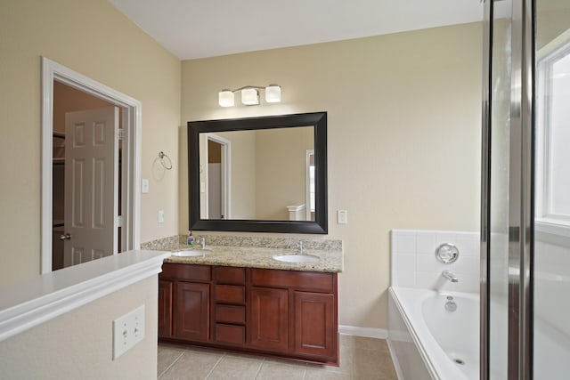 8727 Debbie Terrace Dr, Cypress, TX 77433 - bathroom with double vanity, a bath, tile patterned flooring, and baseboards