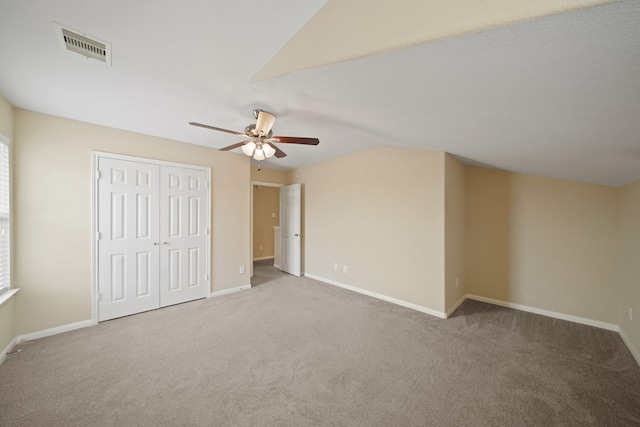 8727 Debbie Terrace Dr, Cypress, TX 77433 - unfurnished bedroom featuring carpet floors, lofted ceiling, baseboards, and a closet