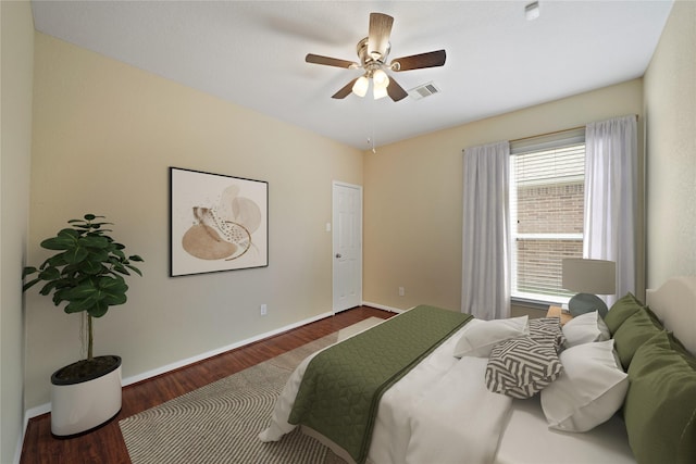 8727 Debbie Terrace Dr, Cypress, TX 77433 - bedroom featuring wood finished floors, baseboards, and ceiling fan