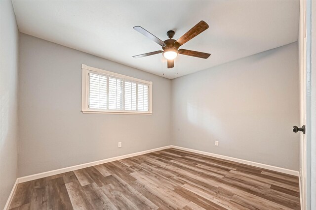 3022 Falling Brook Dr, Kingwood, TX 77345 - empty room featuring a ceiling fan, baseboards, and wood finished floors