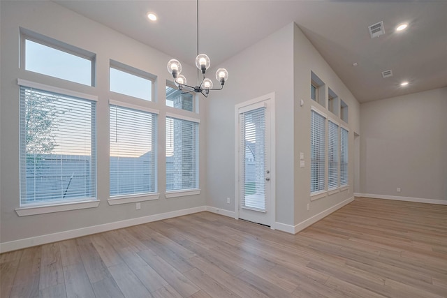 5106 Blooming Hibiscus Ln, Manvel, TX 77578 - unfurnished dining area featuring a chandelier, light wood finished floors, baseboards, and recessed lighting