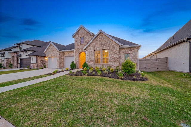 5106 Blooming Hibiscus Ln, Manvel, TX 77578 - view of front of home with driveway, brick siding, a garage, a yard, and a shingled roof