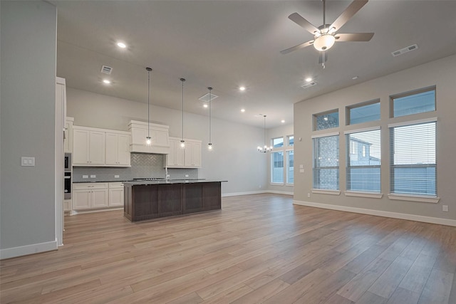 5106 Blooming Hibiscus Ln, Manvel, TX 77578 - kitchen with open floor plan, ceiling fan, light wood-type flooring, and recessed lighting