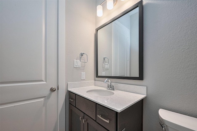 5106 Blooming Hibiscus Ln, Manvel, TX 77578 - half bath with vanity, toilet, and a textured wall