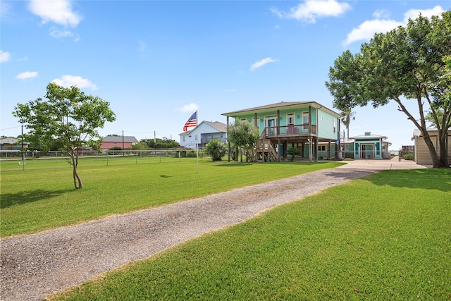 815 5th St, San Leon, TX 77539 - view of green lawn featuring gravel driveway
