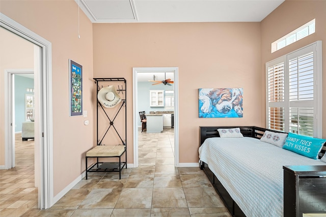 815 5th St, San Leon, TX 77539 - bedroom featuring multiple windows, baseboards, and a towering ceiling