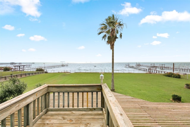 815 5th St, San Leon, TX 77539 - wooden terrace featuring a water view and a lawn