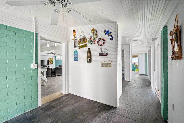 815 5th St, San Leon, TX 77539 - corridor with a desk and dark tile patterned flooring