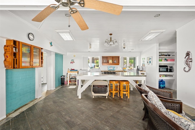 815 5th St, San Leon, TX 77539 - kitchen featuring brown cabinetry, ceiling fan, open shelves, glass insert cabinets, and dark floors