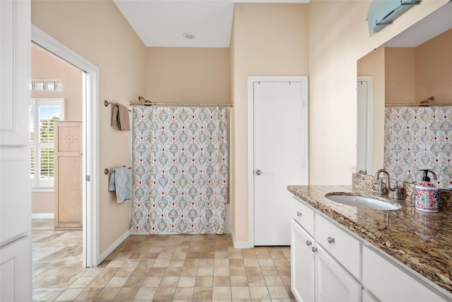 815 5th St, San Leon, TX 77539 - full bathroom featuring vanity, curtained shower, and baseboards