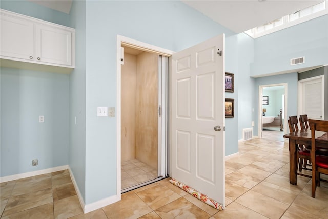 815 5th St, San Leon, TX 77539 - kitchen with white cabinetry and baseboards