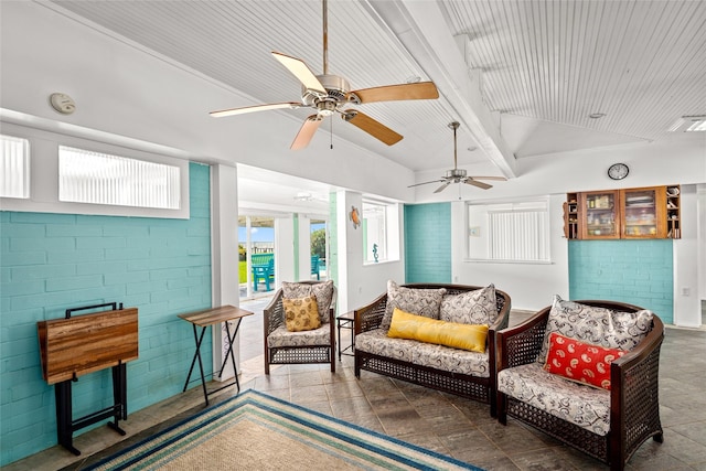815 5th St, San Leon, TX 77539 - sitting room with a ceiling fan, brick wall, and wood ceiling