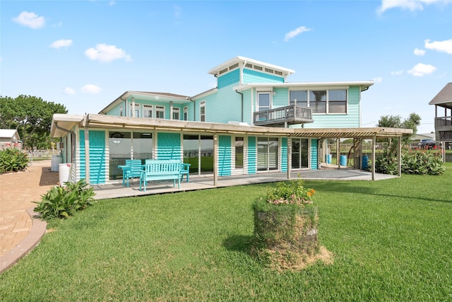 815 5th St, San Leon, TX 77539 - back of property featuring a yard and a patio area