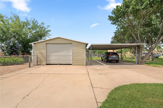 815 5th St, San Leon, TX 77539 - garage with concrete driveway and a detached garage