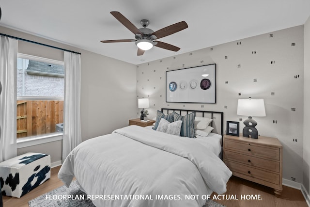 8043 Kay Harbor Dr, Cypress, TX 77433 - bedroom with wood finished floors, baseboards, and ceiling fan