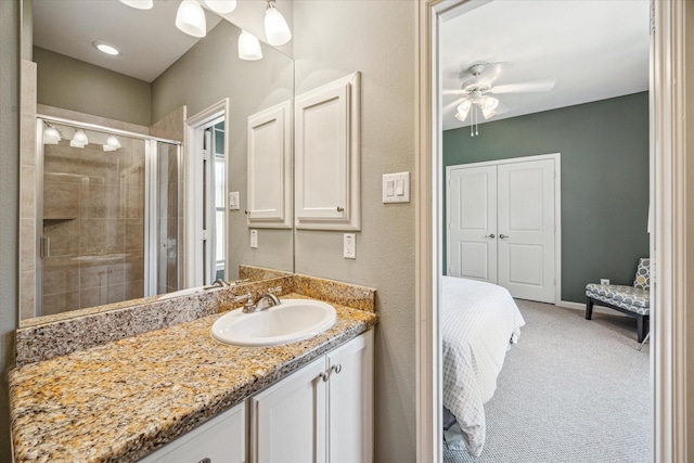 574 Bomar St, Houston, TX 77006 - bathroom featuring connected bathroom, a shower stall, vanity, and ceiling fan