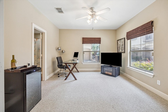 574 Bomar St, Houston, TX 77006 - carpeted office space with plenty of natural light, a ceiling fan, and baseboards