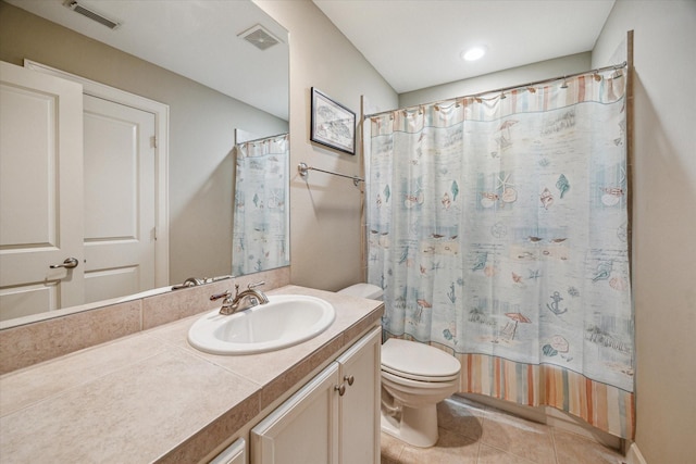 574 Bomar St, Houston, TX 77006 - bathroom with vanity, toilet, and tile patterned floors