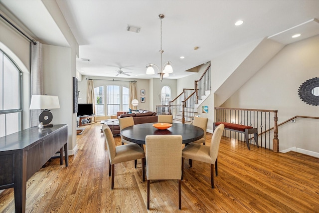 574 Bomar St, Houston, TX 77006 - dining room featuring baseboards, wood finished floors, ceiling fan, recessed lighting, and stairway