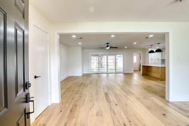 2519 Parana Dr, Houston, TX 77080 - unfurnished living room with light wood finished floors, a ceiling fan, recessed lighting, and baseboards
