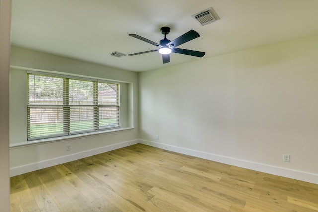 2519 Parana Dr, Houston, TX 77080 - spare room featuring light wood finished floors, a ceiling fan, and baseboards
