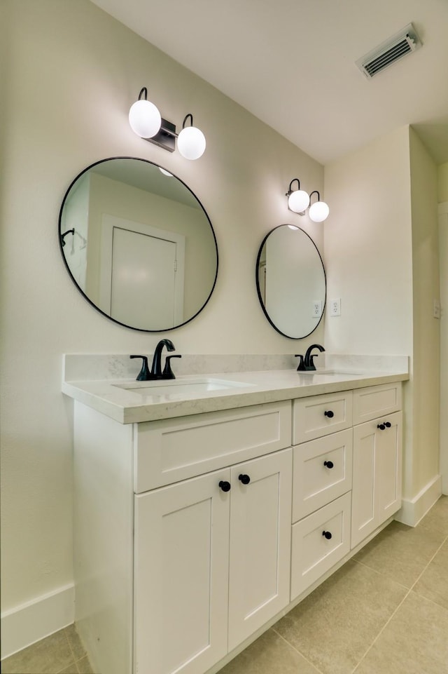 2519 Parana Dr, Houston, TX 77080 - full bath with tile patterned flooring, baseboards, and double vanity