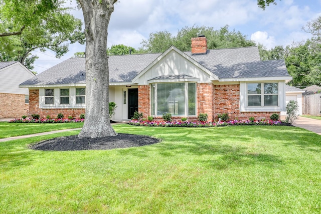 2519 Parana Dr, Houston, TX 77080 - view of front of property with a chimney, brick siding, roof with shingles, and a garage