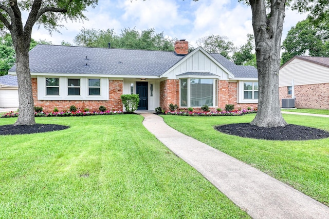 2519 Parana Dr, Houston, TX 77080 - ranch-style house featuring brick siding, a chimney, roof with shingles, a front lawn, and board and batten siding