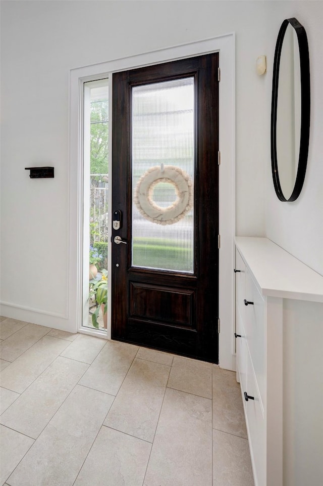 5317 Lillian St, Houston, TX 77007 - entryway featuring light tile patterned flooring and baseboards