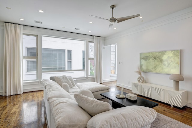 5317 Lillian St, Houston, TX 77007 - living area featuring radiator heating unit, wood finished floors, ceiling fan, crown molding, and recessed lighting