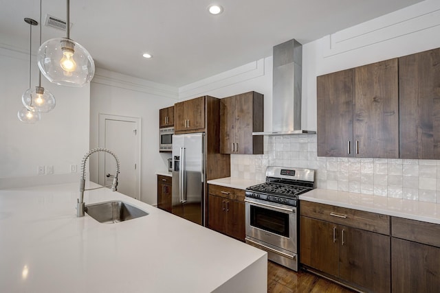 5317 Lillian St, Houston, TX 77007 - kitchen with appliances with stainless steel finishes, wall chimney range hood, a sink, light countertops, and decorative backsplash