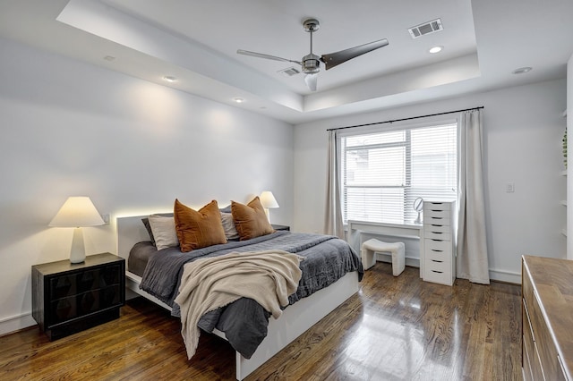 5317 Lillian St, Houston, TX 77007 - bedroom with a tray ceiling, wood finished floors, a ceiling fan, recessed lighting, and baseboards