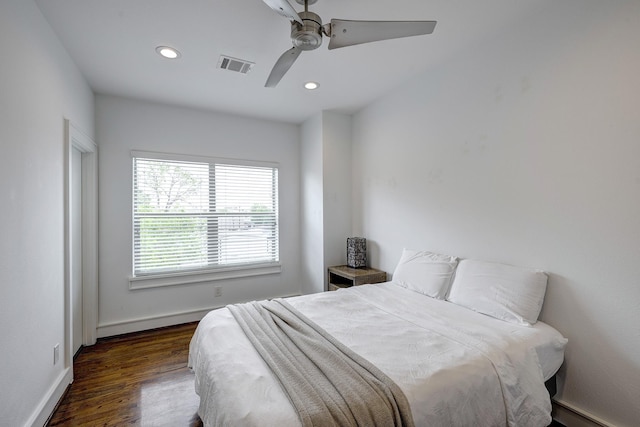 5317 Lillian St, Houston, TX 77007 - bedroom featuring recessed lighting, wood finished floors, a baseboard heating unit, baseboards, and ceiling fan